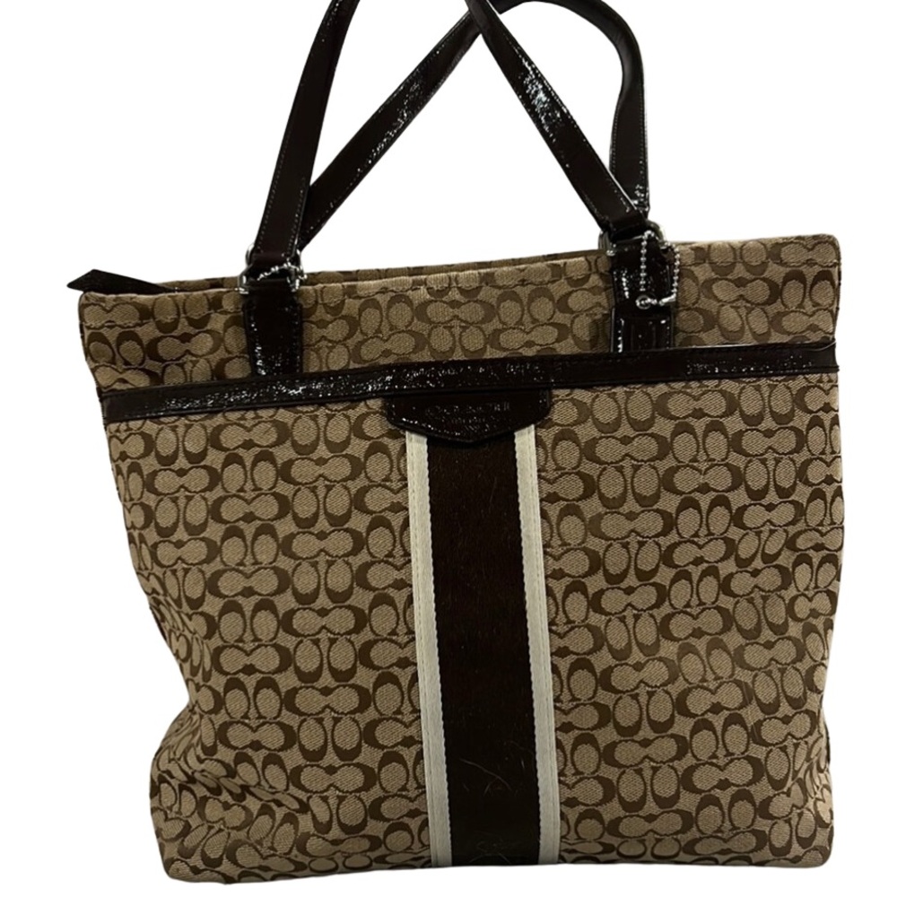 Coach Medium size brown canvas handbag.